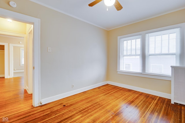 3619 Salem St, Indianapolis, IN 46208 - empty room featuring baseboards, ceiling fan, light wood-style flooring, and crown molding