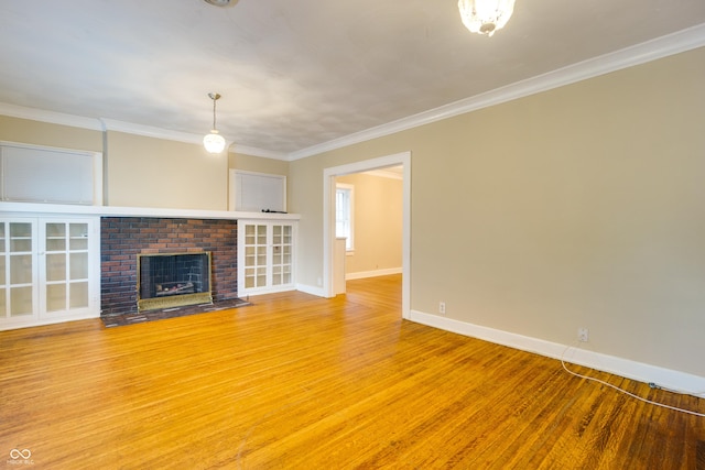 3619 Salem St, Indianapolis, IN 46208 - unfurnished living room with baseboards, a fireplace, light wood-style floors, and crown molding