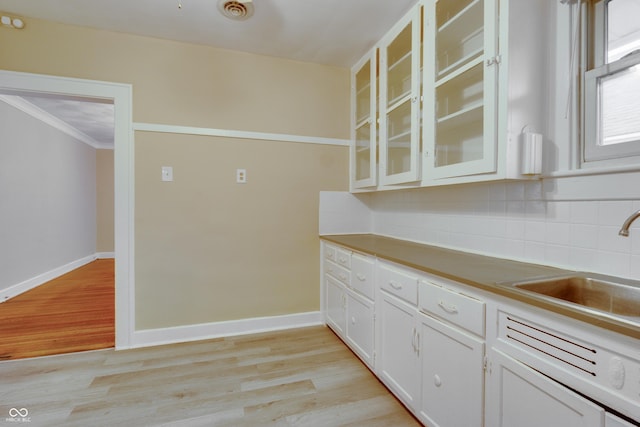 3619 Salem St, Indianapolis, IN 46208 - kitchen with backsplash, baseboards, and light wood finished floors