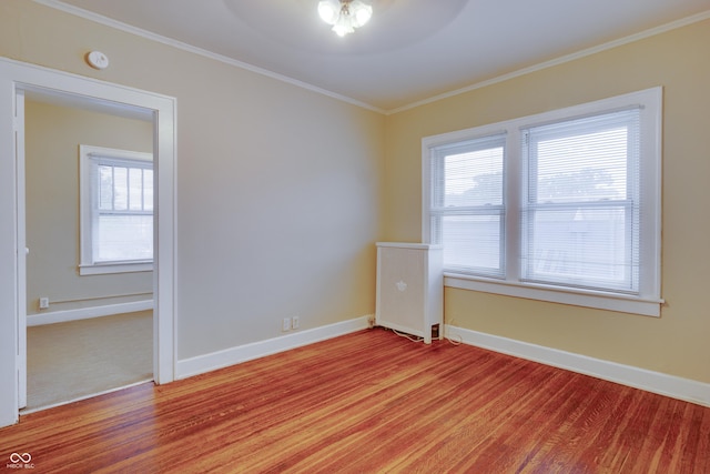 3619 Salem St, Indianapolis, IN 46208 - spare room featuring baseboards, crown molding, and light wood-style flooring