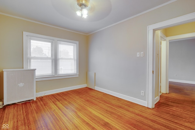 3619 Salem St, Indianapolis, IN 46208 - unfurnished room featuring baseboards, crown molding, light wood-style flooring, and a ceiling fan