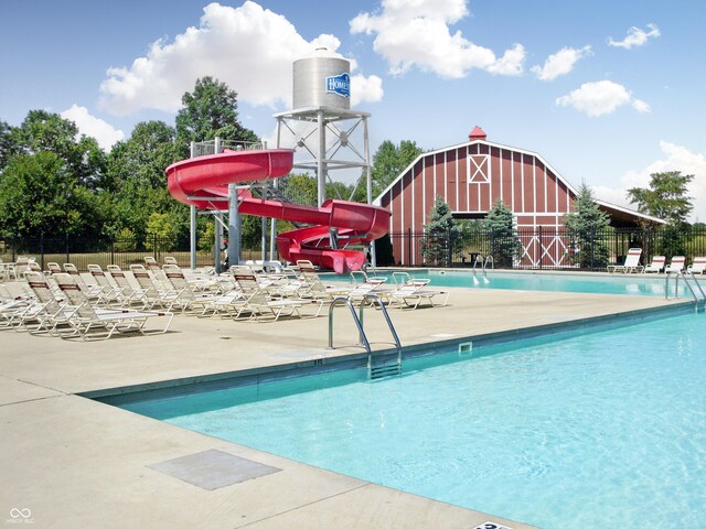 3241 W Keepsake Ln, Monrovia, IN 46157 - community pool with a patio area, a water slide, fence, and a barn