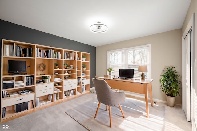 carpeted office with baseboards