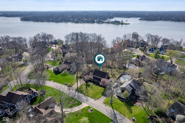 drone / aerial view with a residential view and a water view