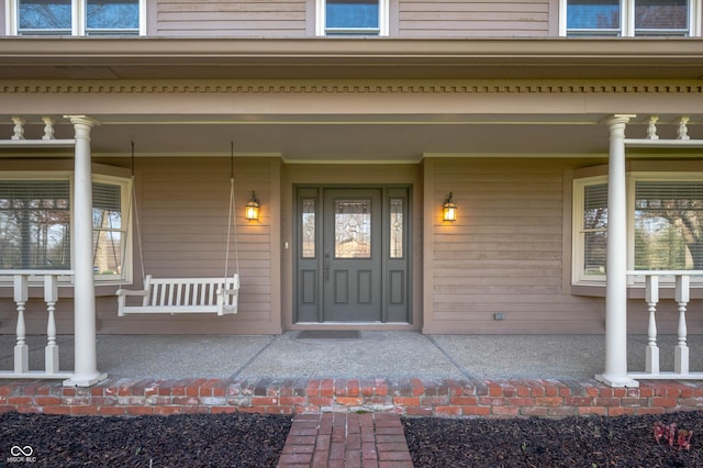 property entrance with a porch