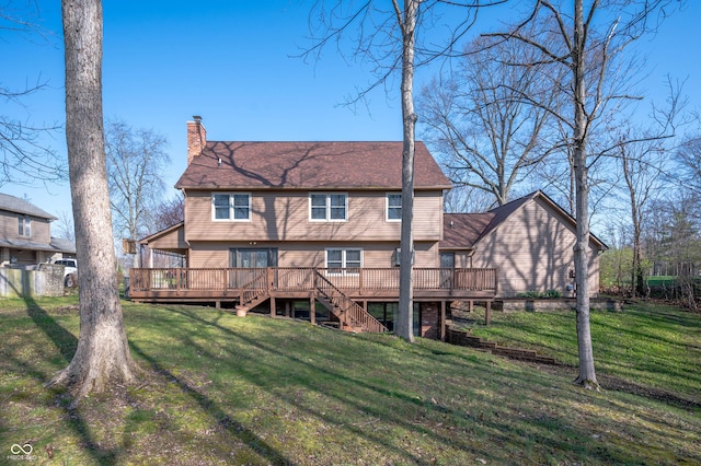 rear view of house with a chimney, a wooden deck, stairway, and a yard