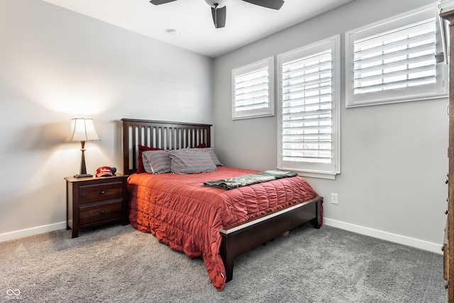 carpeted bedroom with baseboards and a ceiling fan