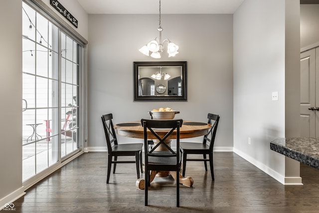 dining space with baseboards, a chandelier, and dark wood-style floors