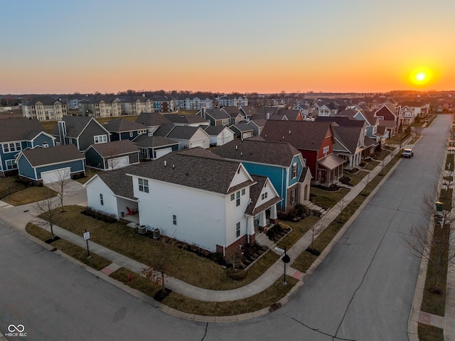 aerial view at dusk with a residential view