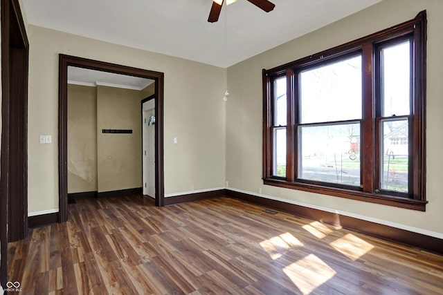 1157 Division St, Noblesville, IN 46060 - empty room featuring a ceiling fan, dark wood-style floors, and crown molding