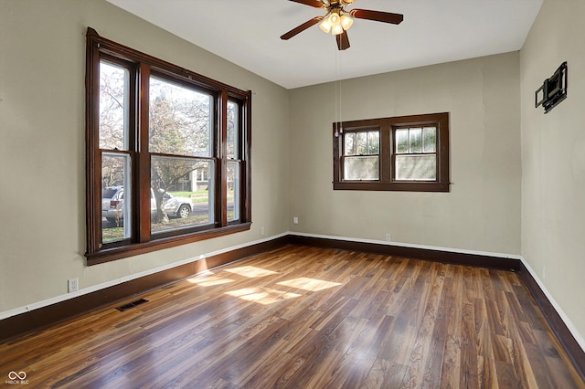 1157 Division St, Noblesville, IN 46060 - empty room with dark wood-style flooring, a ceiling fan, and plenty of natural light