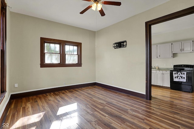 1157 Division St, Noblesville, IN 46060 - spare room featuring a ceiling fan and dark wood-style flooring