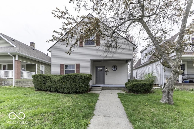 view of front of house featuring covered porch and a front yard