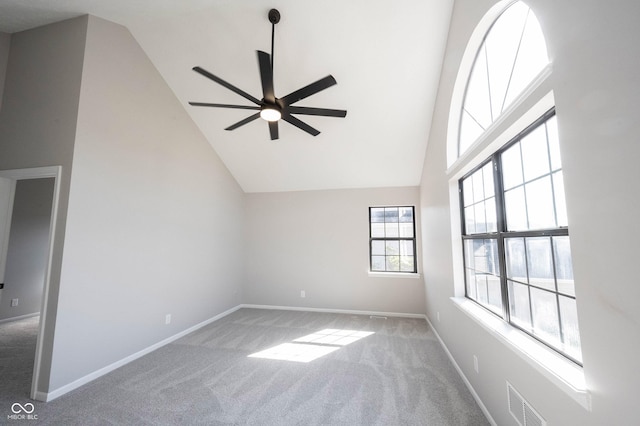 interior space with high vaulted ceiling, visible vents, ceiling fan, and carpet floors
