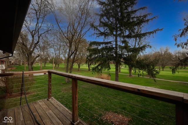 wooden terrace with a lawn