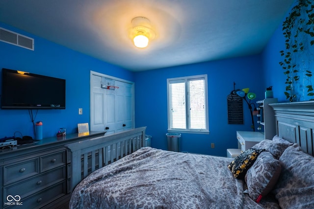 bedroom with a closet and visible vents