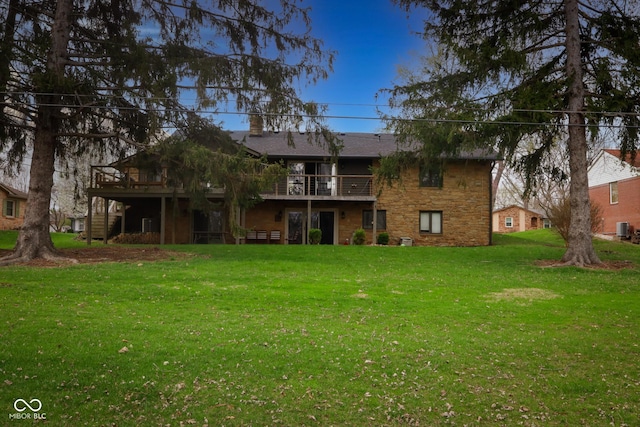 exterior space with stone siding, stairway, cooling unit, a wooden deck, and a yard