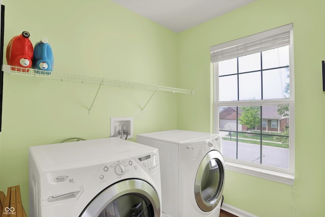 laundry area featuring washing machine and clothes dryer