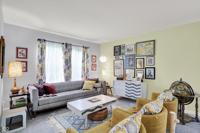 carpeted living area featuring baseboards