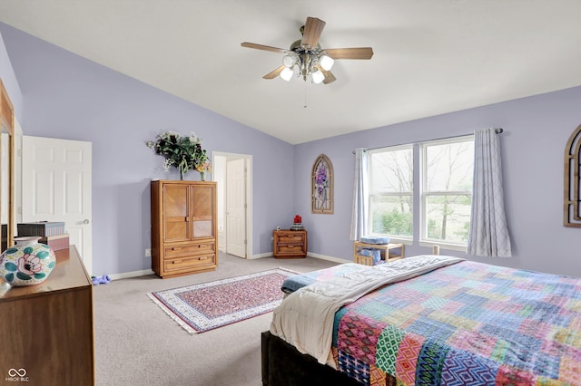 bedroom featuring lofted ceiling, light carpet, baseboards, and ceiling fan