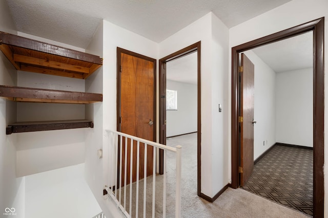 2804 Paso Del Norte Dr, Indianapolis, IN 46227 - hallway featuring carpet flooring, an upstairs landing, and baseboards