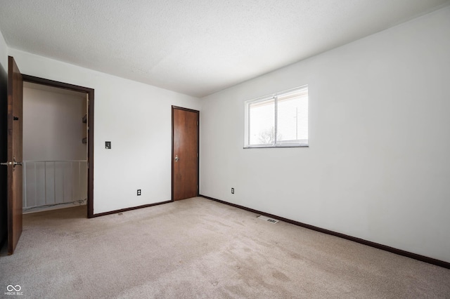 2804 Paso Del Norte Dr, Indianapolis, IN 46227 - unfurnished bedroom with light carpet, a closet, and baseboards