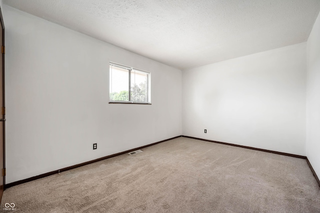 2804 Paso Del Norte Dr, Indianapolis, IN 46227 - unfurnished room with carpet, baseboards, and a textured ceiling