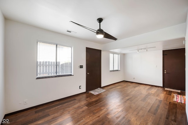 2804 Paso Del Norte Dr, Indianapolis, IN 46227 - unfurnished living room featuring ceiling fan, wood finished floors, and baseboards