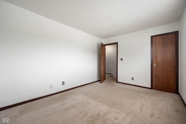 2804 Paso Del Norte Dr, Indianapolis, IN 46227 - unfurnished bedroom featuring light colored carpet and baseboards