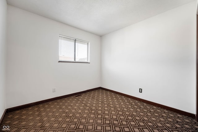 2804 Paso Del Norte Dr, Indianapolis, IN 46227 - empty room featuring baseboards and dark floors