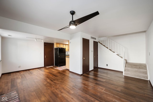 2804 Paso Del Norte Dr, Indianapolis, IN 46227 - unfurnished living room with stairs, dark wood-style floors, ceiling fan, and baseboards