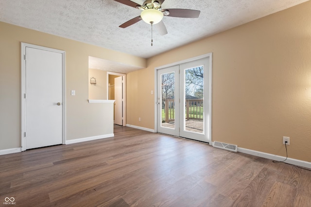 745 W Banta Rd, Indianapolis, IN 46217 - spare room with visible vents, baseboards, wood finished floors, and a textured ceiling