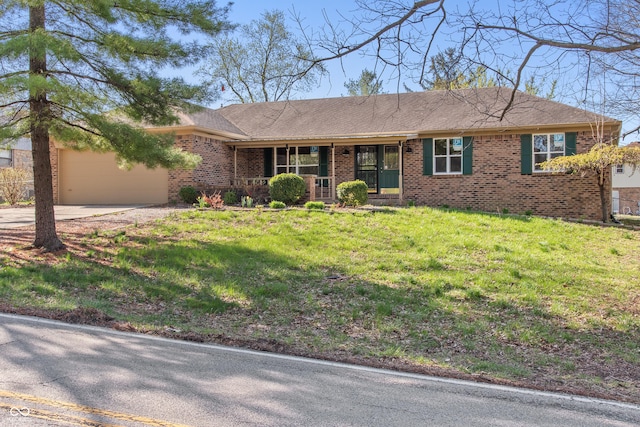 745 W Banta Rd, Indianapolis, IN 46217 - single story home featuring concrete driveway, brick siding, a front lawn, and an attached garage