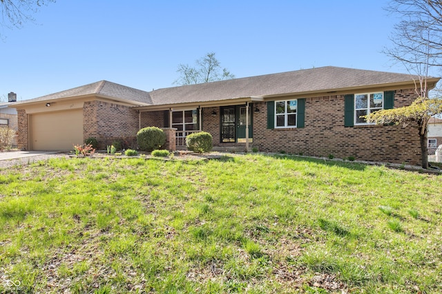 745 W Banta Rd, Indianapolis, IN 46217 - single story home with brick siding, an attached garage, a front lawn, and concrete driveway