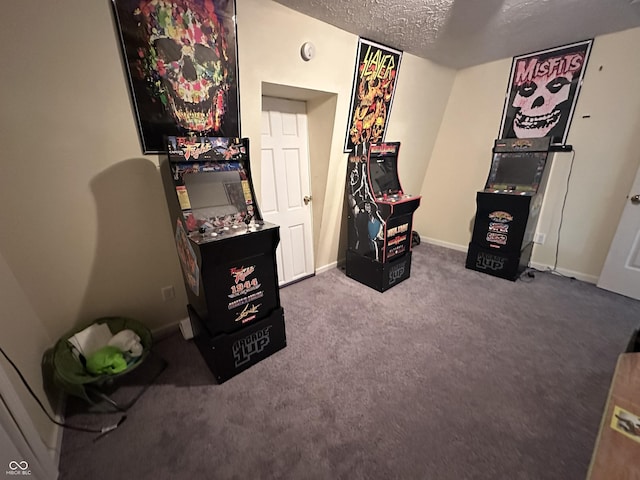 game room featuring carpet flooring, a textured ceiling, and baseboards
