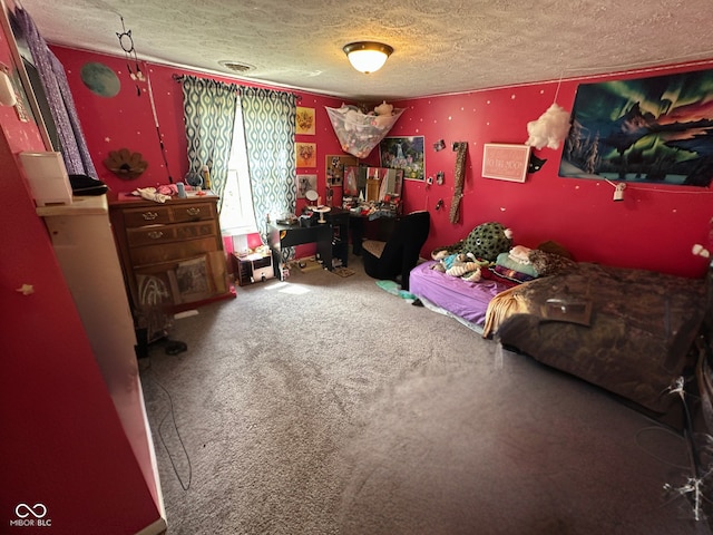 bedroom featuring carpet flooring and a textured ceiling