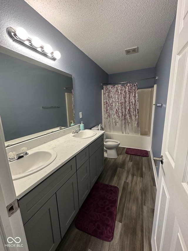 1071 Hazelwood Dr, Greenwood, IN 46143 - bathroom featuring toilet, wood finished floors, a sink, and visible vents