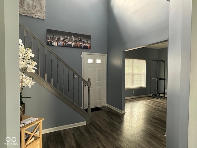 1071 Hazelwood Dr, Greenwood, IN 46143 - foyer with baseboards, a high ceiling, wood finished floors, and stairs