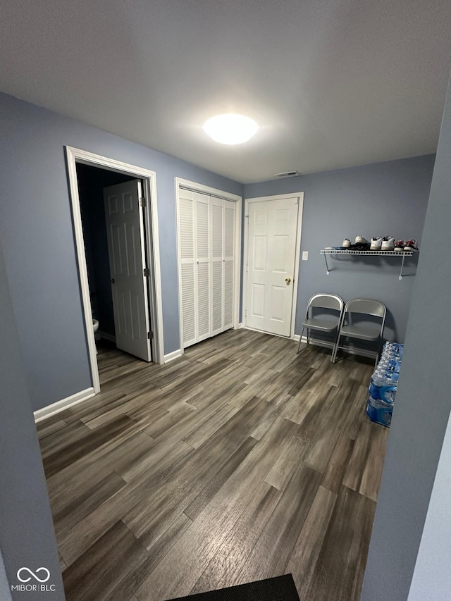 1071 Hazelwood Dr, Greenwood, IN 46143 - bedroom featuring visible vents, baseboards, and wood finished floors