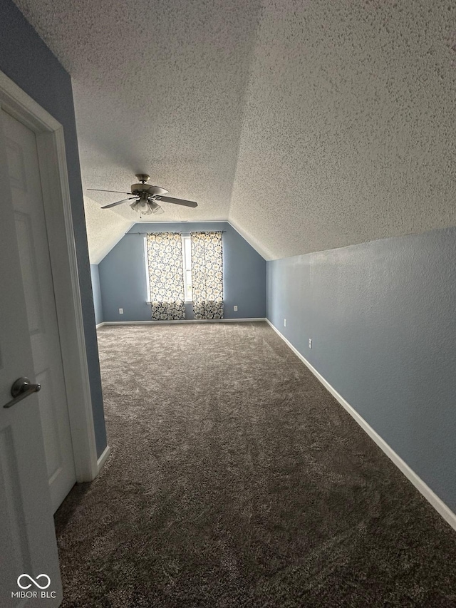 1071 Hazelwood Dr, Greenwood, IN 46143 - bonus room with a textured ceiling, a ceiling fan, lofted ceiling, and carpet floors