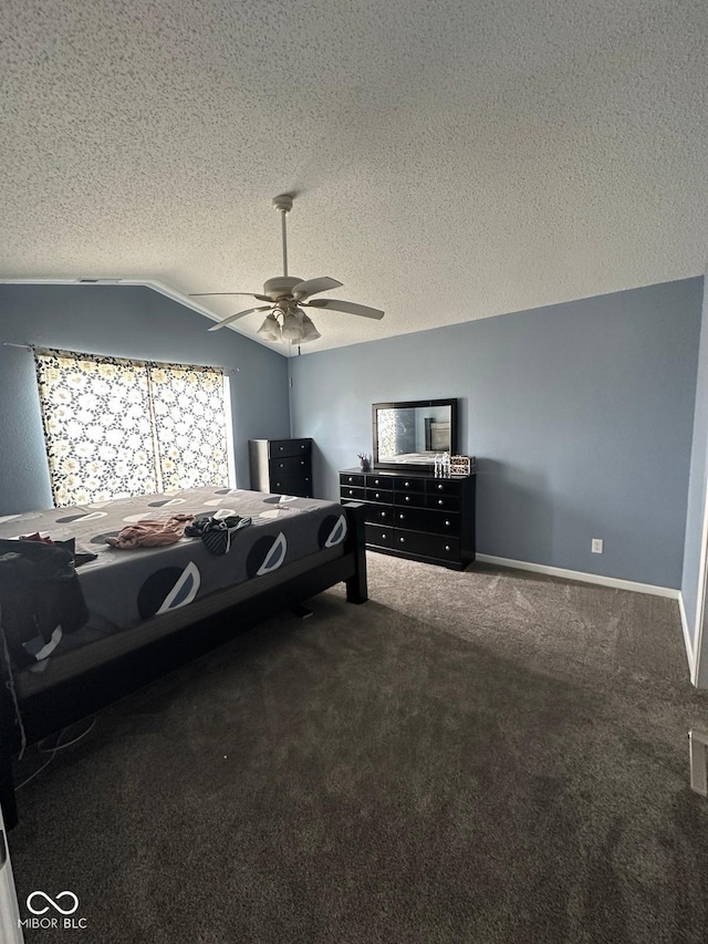 1071 Hazelwood Dr, Greenwood, IN 46143 - carpeted bedroom featuring baseboards, a textured ceiling, vaulted ceiling, and a ceiling fan