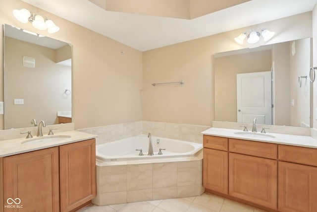 full bathroom with tile patterned floors, a garden tub, a sink, and two vanities