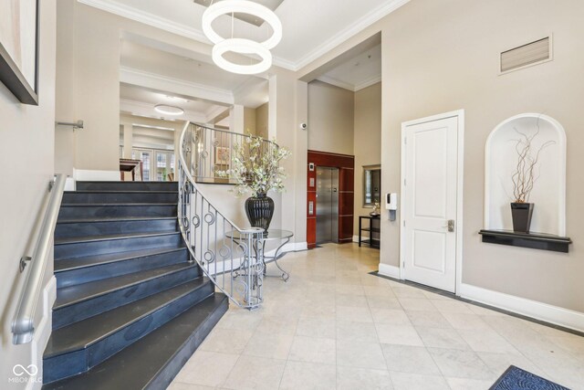 stairs featuring visible vents, crown molding, baseboards, tile patterned floors, and elevator