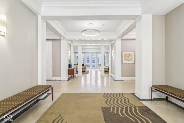 corridor featuring french doors, light tile patterned floors, crown molding, and baseboards