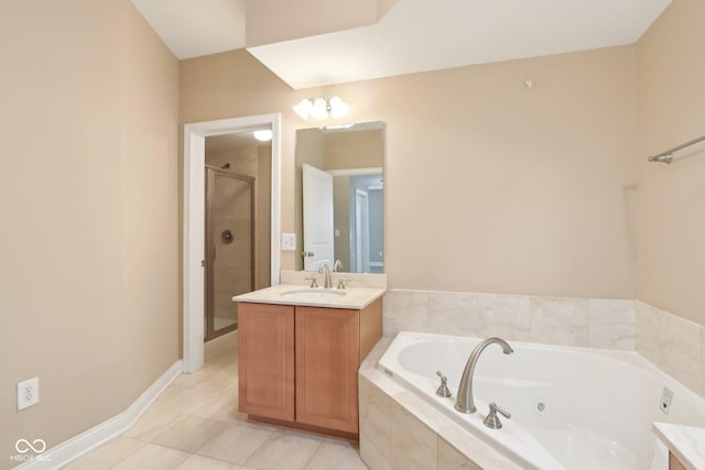 full bathroom featuring a stall shower, vanity, a jetted tub, tile patterned flooring, and baseboards