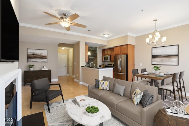 355 E Ohio St Unit 309, Indianapolis, IN 46204 - living area featuring light wood-style flooring, a ceiling fan, baseboards, a chandelier, and ornamental molding