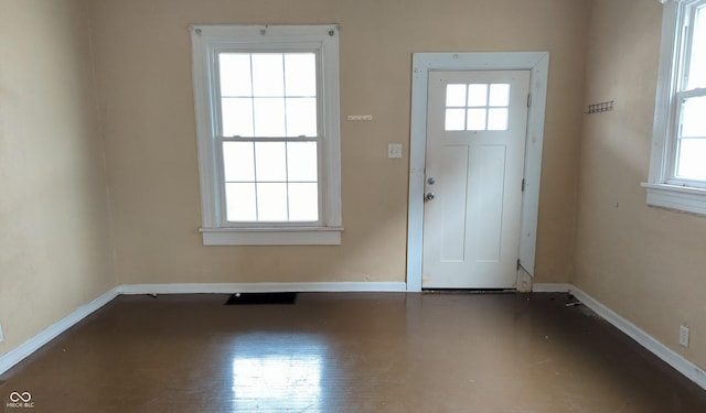 entryway featuring baseboards