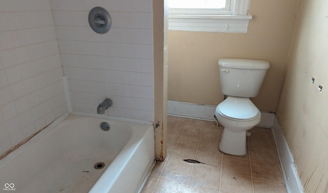 full bathroom with tile patterned floors, toilet, and baseboards