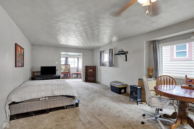carpeted bedroom with a ceiling fan