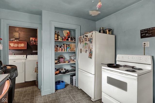 kitchen featuring white cabinets, washer and dryer, and white appliances